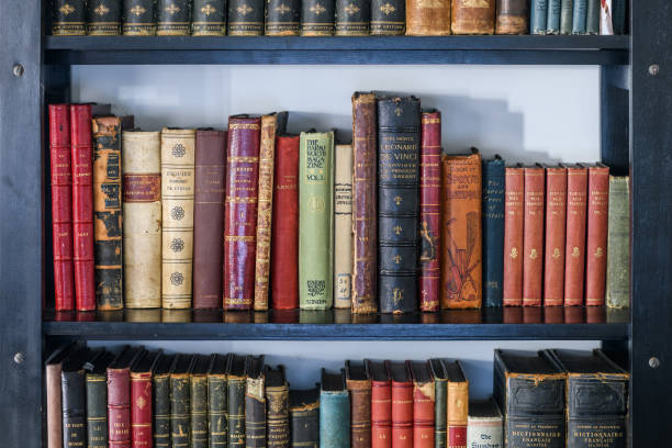 Antique 19th century books in bookshelf Antique 19th century books in bookshelf