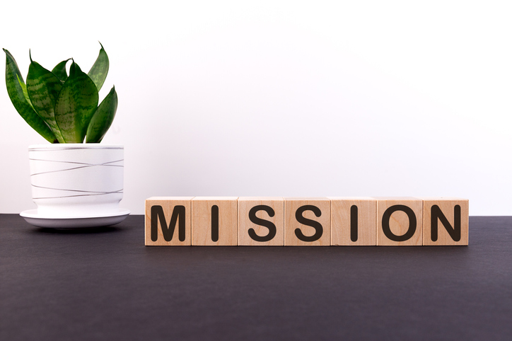 Wooden cubes with word MISSION on a light background Wooden cubes with word MISSION on a light background